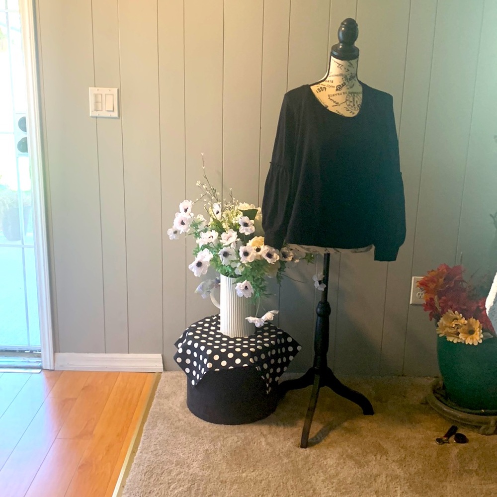 Blouse, black with puff sleeves, short waisted.